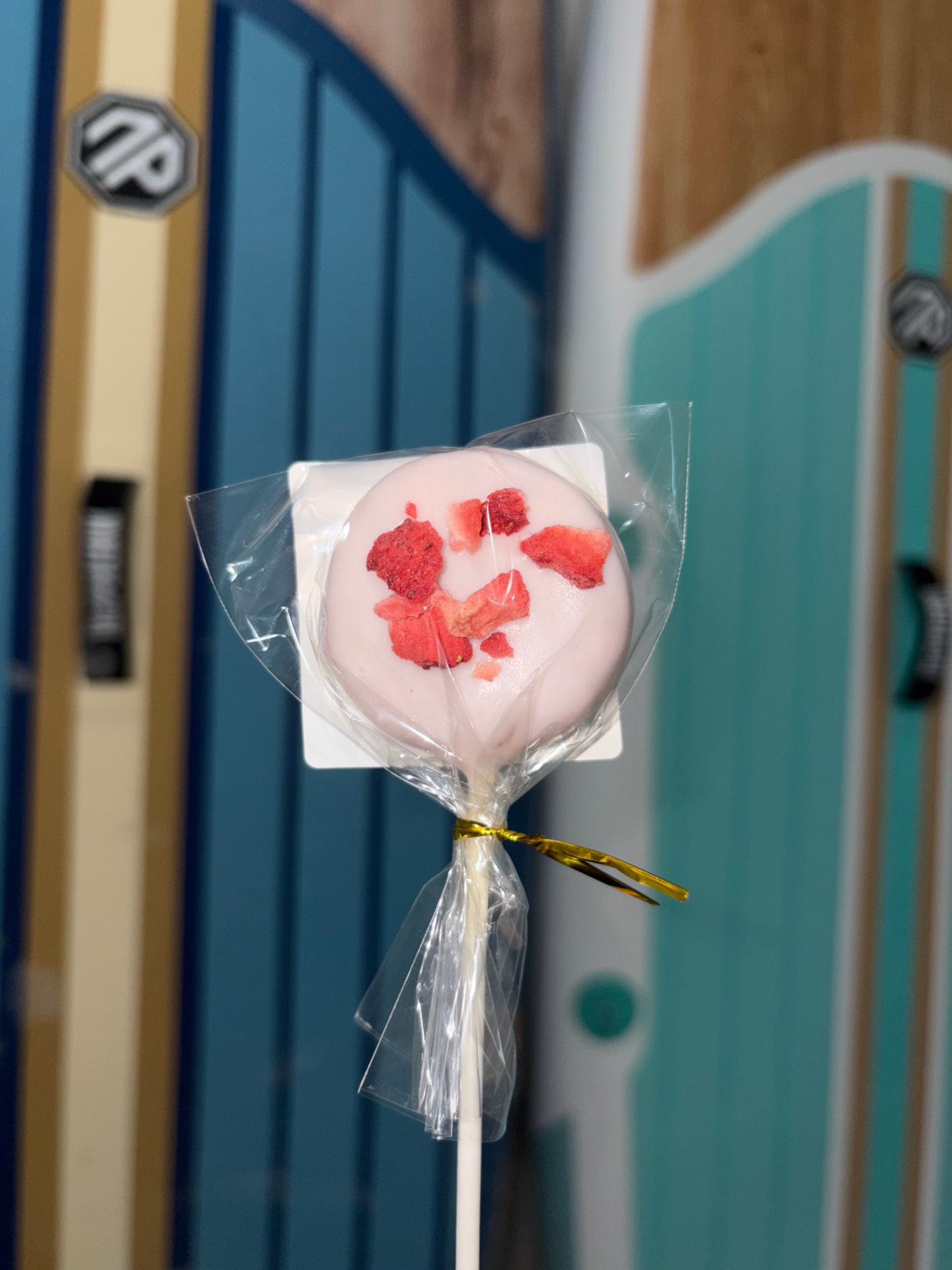 Strawberries and cream cake pop topped with freeze-dried strawberries